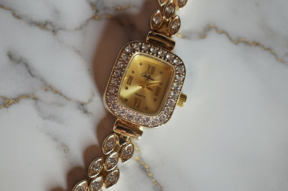 Gold watch with diamond zircon