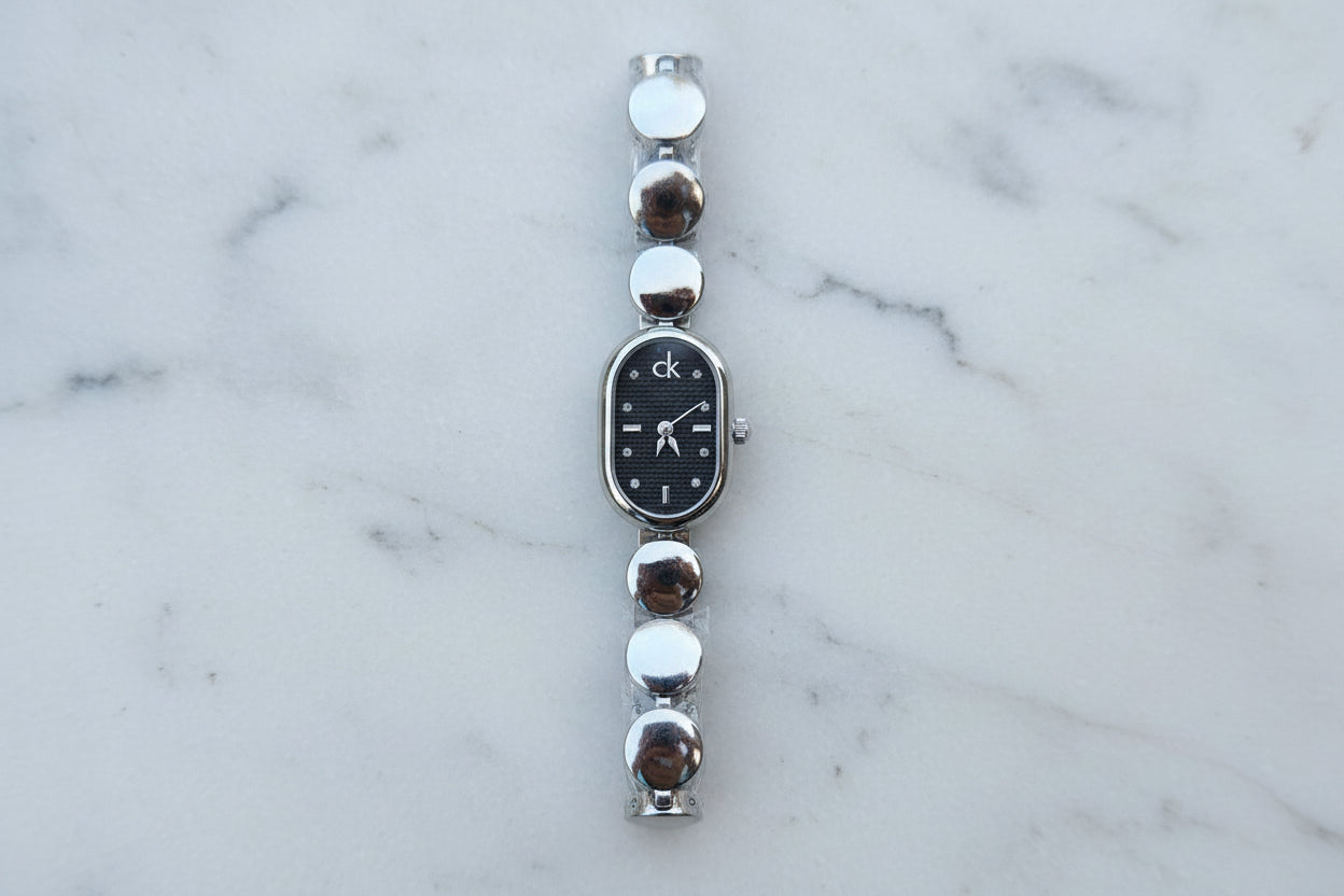 Silver C-K watch (which, black)and mix silver X gold with black Dial.