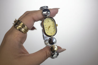 Oval C-K mix gold X silver watch with light gold dail