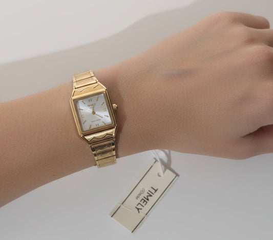 Gold Timely Rain gold watch with white dial.
