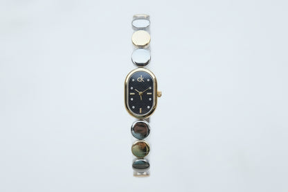 Silver C-K watch (which, black)and mix silver X gold with black Dial.