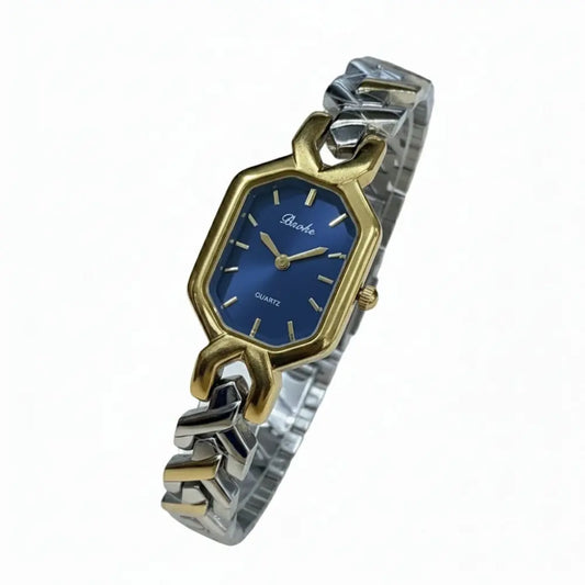 Two-tone silver and gold women’s watch with royal blue dial and hexagon case