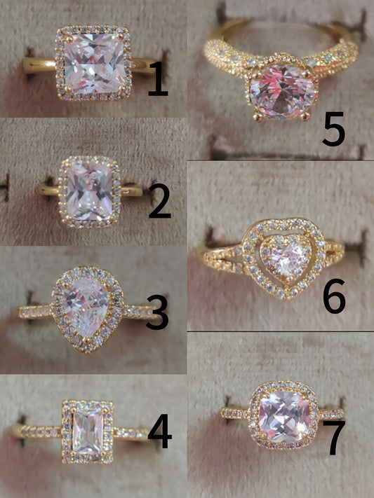 7 Elegant Designs - Gold Plated Stainless Steel Solitaire Rings with Zircon Stones (Free Size)