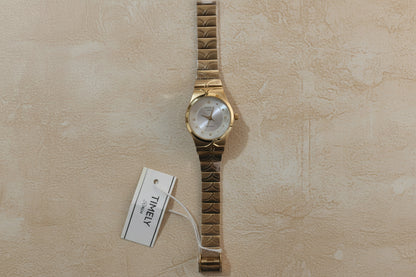 Gold Timely rain watch with white dial.