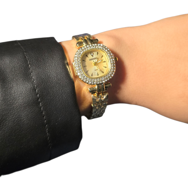 Gold watch with elegant gold dial.