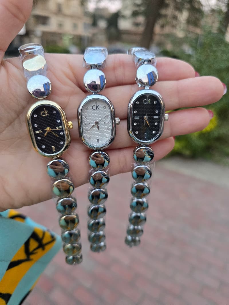 Silver C-K watch (which, black)and mix silver X gold with black Dial.