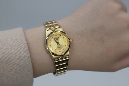 Tim-ely gold watch with gold dail