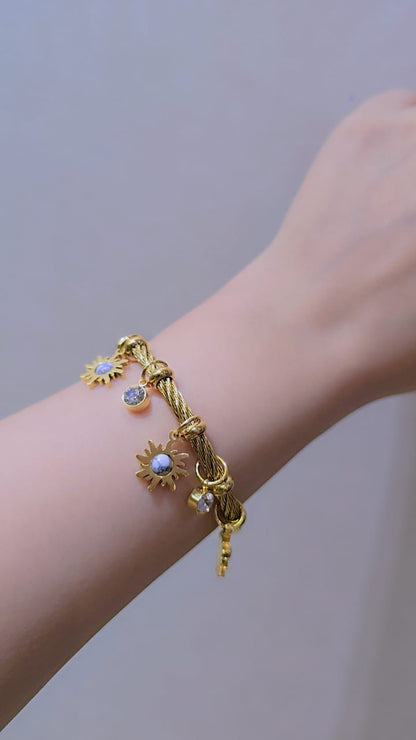 Golden Cable Bracelet with Sun Charms, White Stone & Crystal Details – Gold Plated Stainless Steel