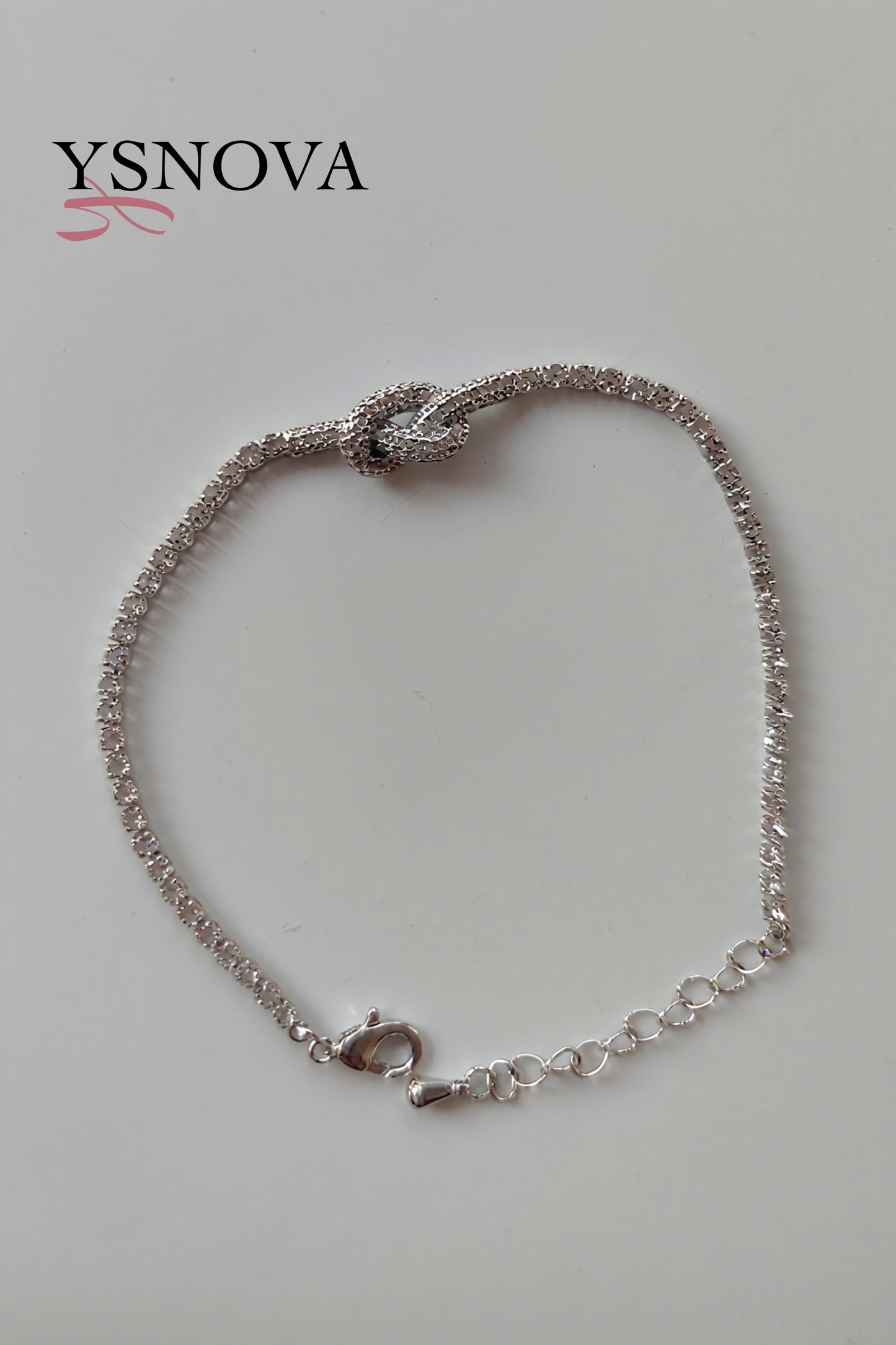 Gold or Silver Plated Stainless Steel Women’s Tennis Bracelet with Zircon Love Knot Design