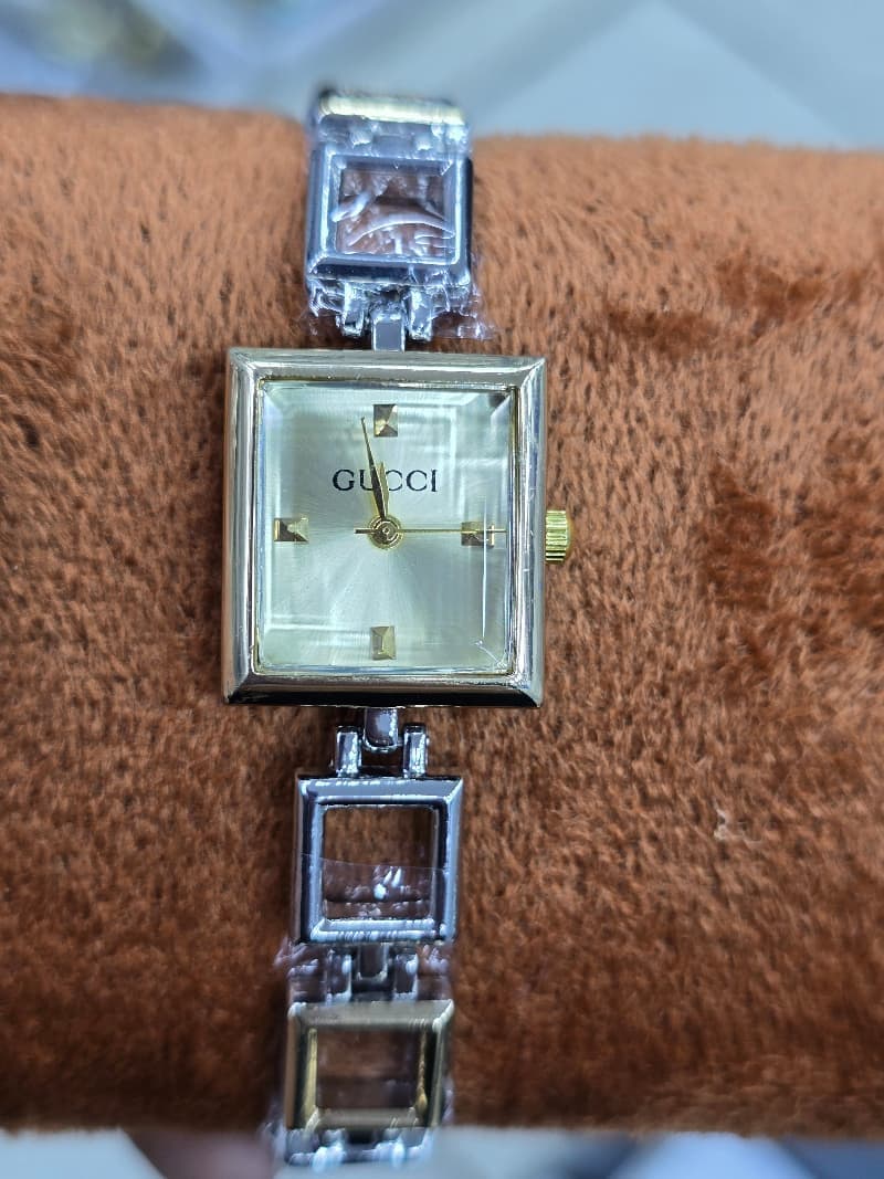 Mix silver X gold open square watch with light gold dail