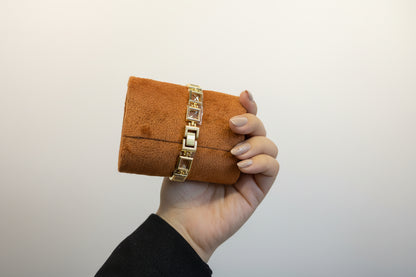 Gold open square watch with gold dail