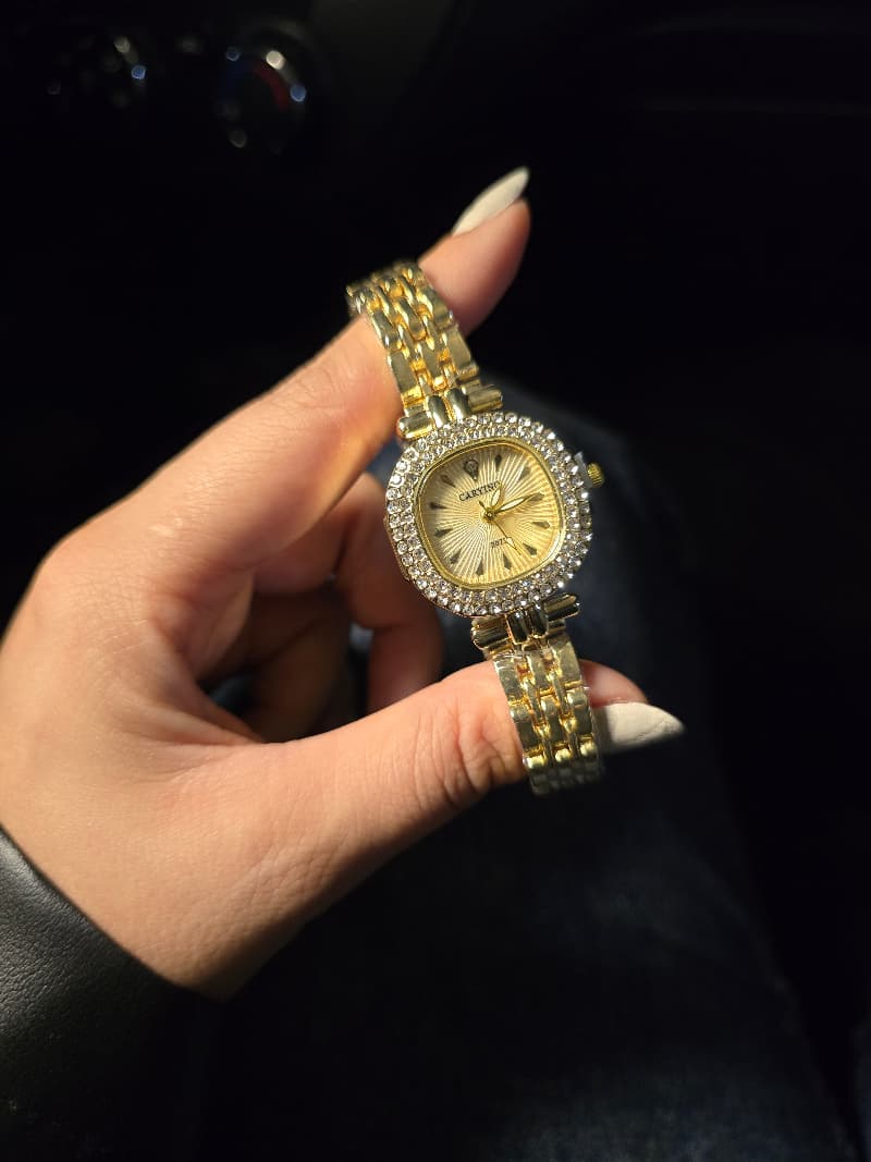 Gold watch with elegant gold dial.