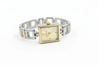 Mix silver X gold open square watch with light gold dail