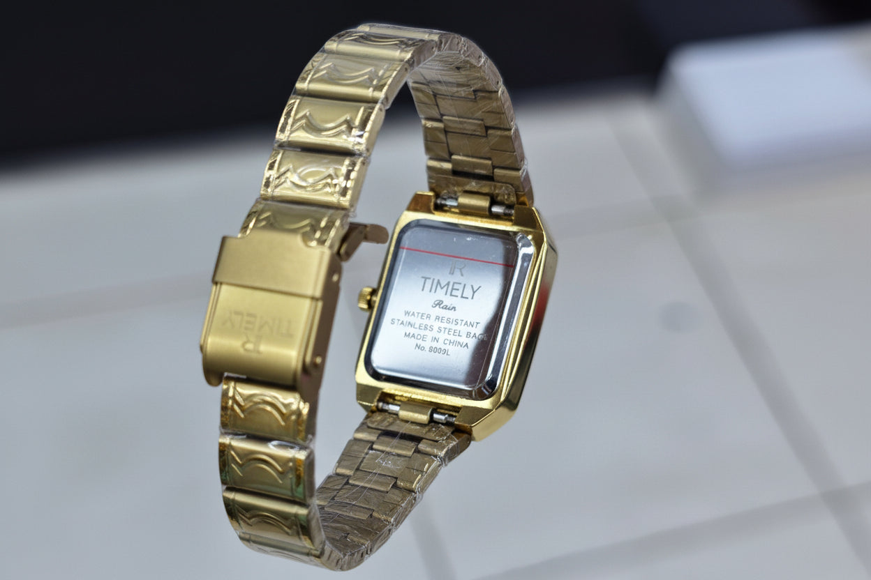 Timely gold watch with gold dail
