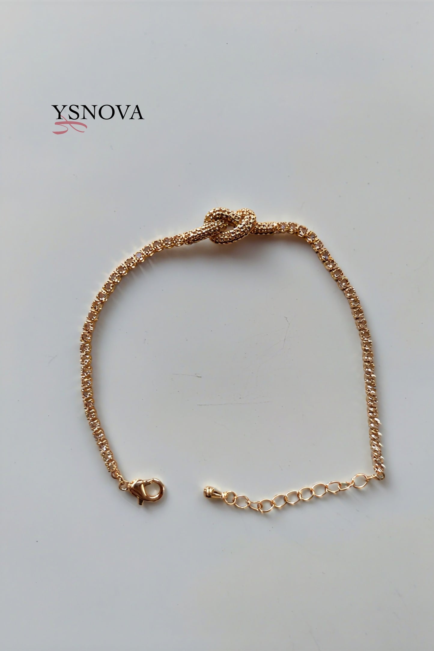 Gold or Silver Plated Stainless Steel Women’s Tennis Bracelet with Zircon Love Knot Design